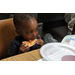 Little boy eating his pizza