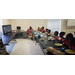 kids sitting at table with popcorn watching television