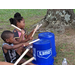 Kids using buckets for drums