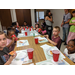 youth sitting around table eating pizza 