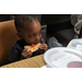 Little boy eating pizza