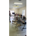 Vacation Bible School youth attendees eating snacks at folding tables 