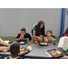 kids enjoying meal table with lunch trays