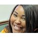 Closeup of a female smiling at FSS rally