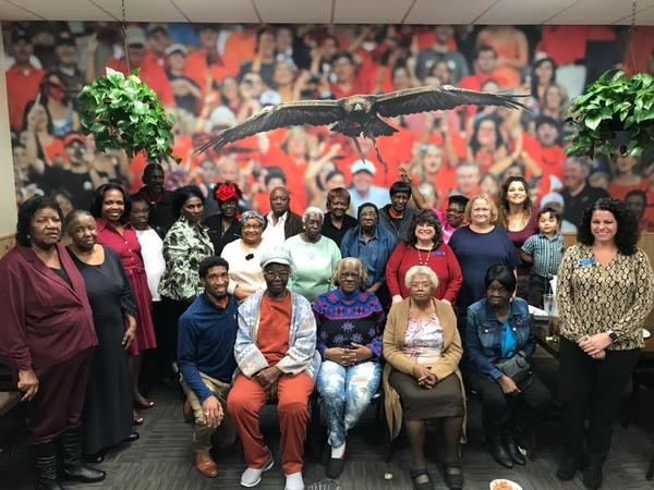 Group of senior residents and staff at holiday luncheon