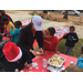 Youth residents and volunteers decorating christmas cookies