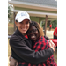 Two females smiling and hugging 