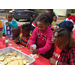 Youth residents decorating cookies