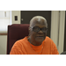 female resident with glasses smiling for camera