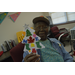 Female resident showing off her Christmas Tree craft