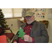 Older male holding his christmas tree craft