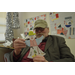 Older male holding his Christmas angel craft