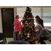 Older residents and volunteers decorating community Christmas tree