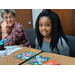 youth female resident and volunteer smiling over crafts