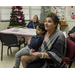 Resident holding little boy at seminar 