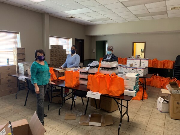 Staff preparing Covid-19 Supply Bags for Distribution