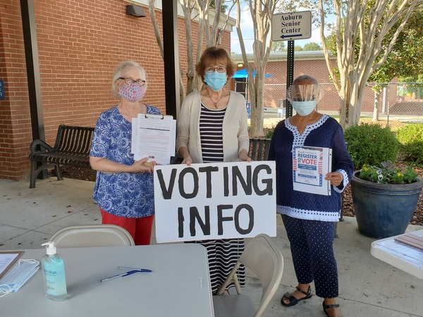 Staff and Commissioner White volunteering during voter registration drive at the Boykin Community Center for residents.