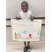 Youth resident smiling showing off his poster drawing 