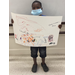 Youth resident holding up his 'What Home Means to Me' poster drawing