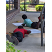 Youth residents outside drawing on posters