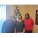 LHA Staff and Commissioner posing in front of Christmas tree 