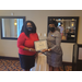 Natasha Hall receiving certificate from CEO Sharon Tolbert