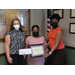 FSS Coordinator Rachel Harris and CEO Shaton Tolbert presenting FSS Graduate Myrteila Welcher with certificate