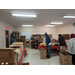 People unloading boxes inside building