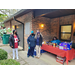 LHA RAB Member Deborah Ray posing outside with female in front of snack table