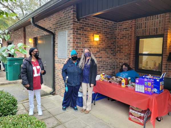 LHA RAB Member Deborah Ray posing outside with female in front of snack table