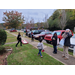 Youth playing cornhole outside