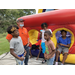 Youth posing near bounce house 