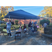 Residents hanging out under tent at tailgate