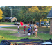 Youth playing outside with jump ropes and balls before movie begins