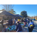 AHA Thanksgiving Farmers Market attendees standing around food boxes