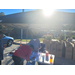 Individual signing in at table to participate in Farmers Market