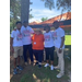 Group of five Auburn Housing Authority staff members posing under a tree outside at the Juneteenth Celebration.