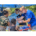 Volunteers are handing out snacks at the back to school event