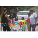 Auburn Police Department staff are talking with youth at their supply table.