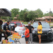 Auburn police officers are distributing school supplies to youth at their supply table in the parking lot 