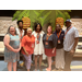 Auburn Housing Authority Staff and Commissioners are posed in front of a wall decorated as a palm tree