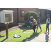 Youth playing outside near the little library