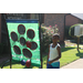 young boy looking at a game at the tailgate event