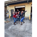 Group of female employees fun stance outside garaged building
