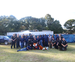 Police Officers, employees, Aubie and some members laying on ground in group 