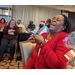 Employees laughing at Christmas luncheon