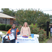 Female vendor and boy giving a thumbs up at Operation CommUNITY event.