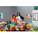 Charlotte Mattox and Tabitha Griffin standing behind a table of toys at the Auburn Public Safety Toy Drive