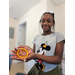 East Park youth resident showing off her bracelet craft