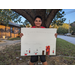 Quinton Copeland holding his winning poster